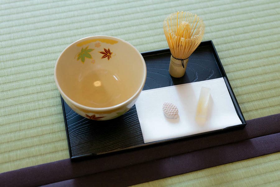 Kyoto tea ceremony experience with traditional Japanese sweets and tea utensils