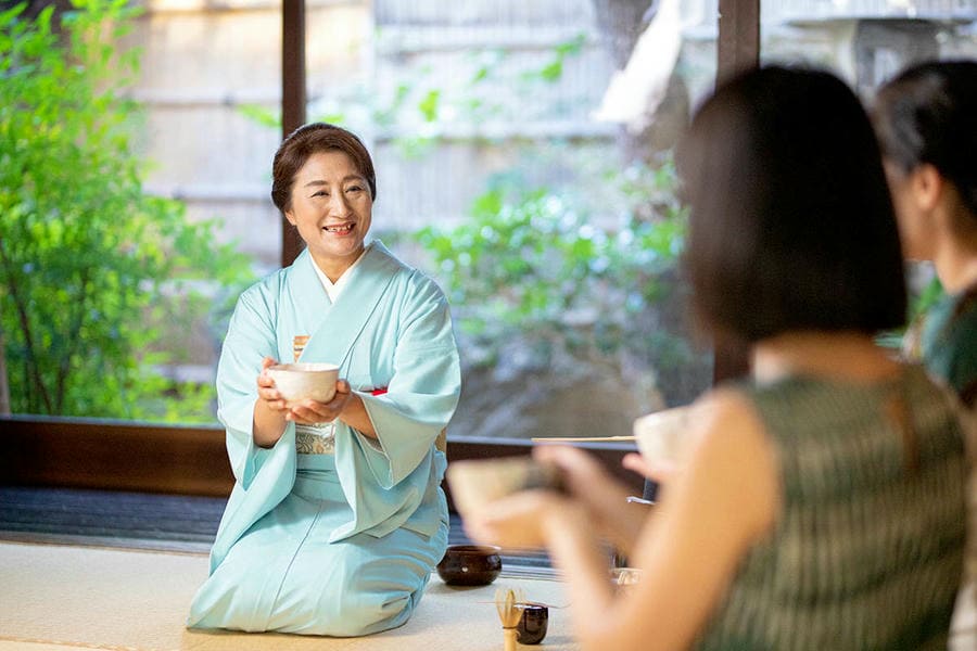 Tea master preparing matcha in a Kyoto townhouse