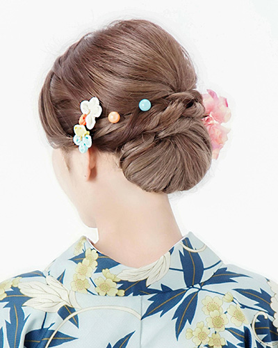 Sleek low chignon hair styling for an elegant and sophisticated Kyoto Kimono Rental day.